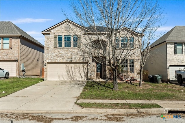 view of property with a garage and a front yard