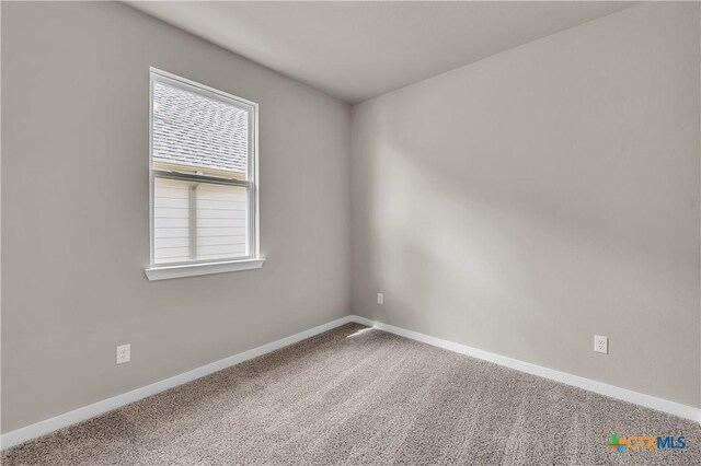 169 Arvil Dr, Killeen, TX 76542 - empty room with carpet flooring, ceiling fan, baseboards, vaulted ceiling, and a smoke detector