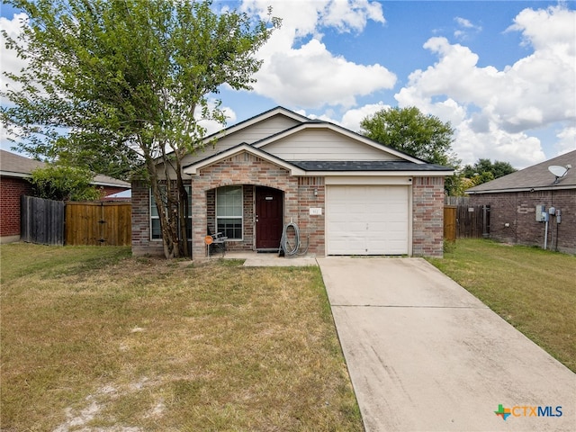 view of front of home with a front lawn and a garage