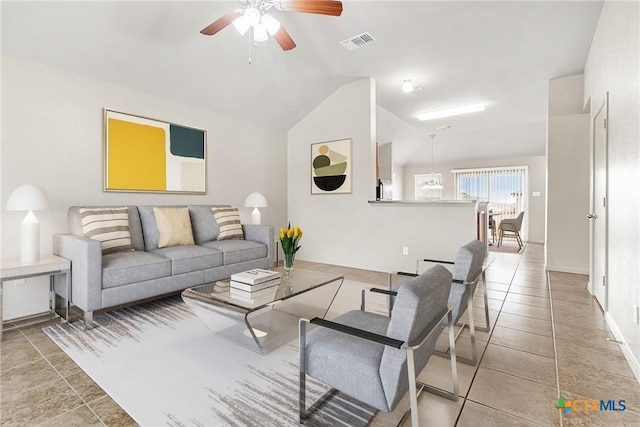 living room featuring vaulted ceiling, light tile patterned floors, and ceiling fan