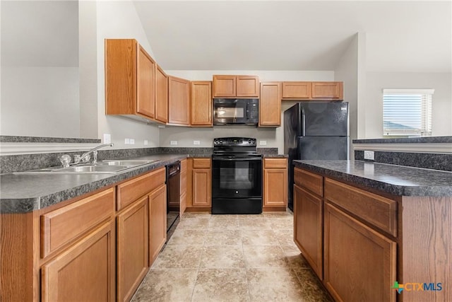 kitchen featuring vaulted ceiling, sink, and black appliances