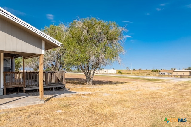 view of yard with a wooden deck