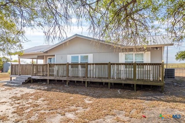 3300 State Highway 95, Shiner, TX 77984 - view of front of property featuring metal roof, a deck, and central AC