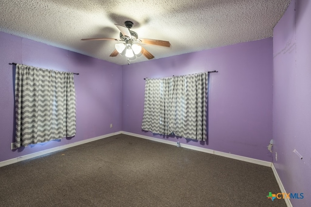 carpeted spare room with ceiling fan and a textured ceiling