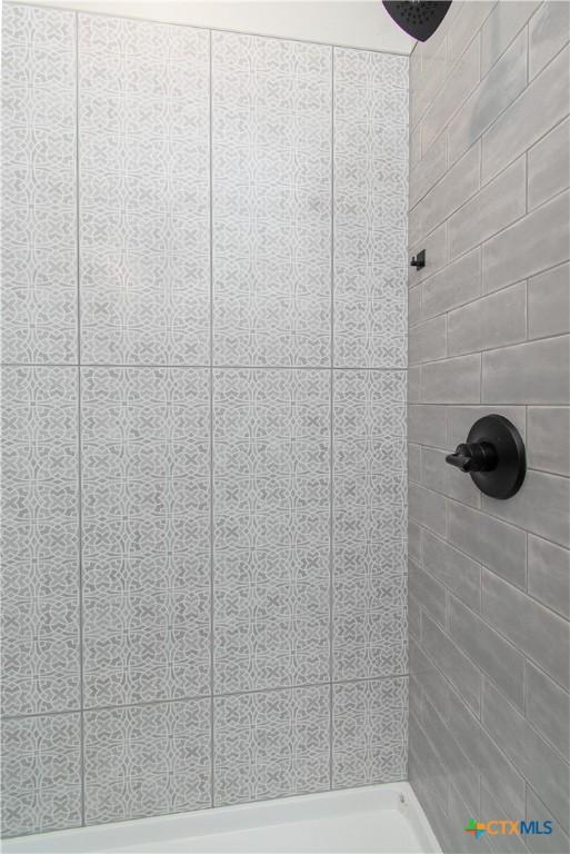 6864 Moffat Loop, Temple, TX 76502 - interior details featuring tiled shower