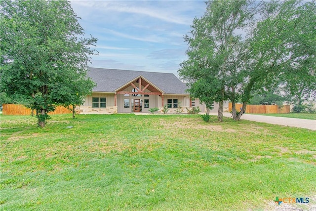 6864 Moffat Loop, Temple, TX 76502 - view of front facade with a shingled roof, fence, french doors, and a front yard