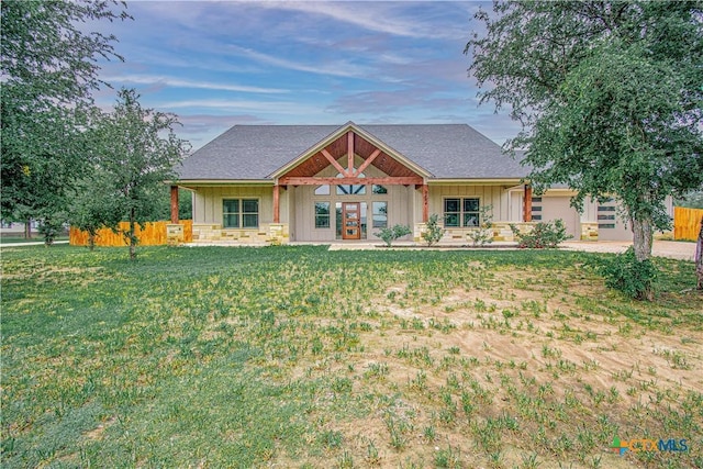6864 Moffat Loop, Temple, TX 76502 - view of front of property with a front lawn, board and batten siding, fence, and french doors