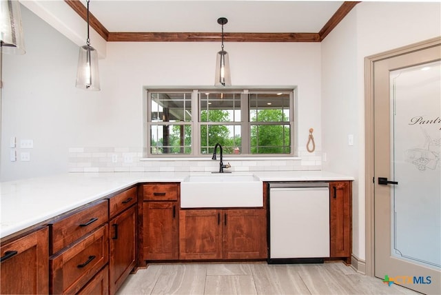 6864 Moffat Loop, Temple, TX 76502 - kitchen with backsplash, light countertops, a sink, and dishwasher
