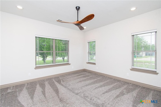 6864 Moffat Loop, Temple, TX 76502 - empty room featuring a healthy amount of sunlight, carpet floors, baseboards, and a ceiling fan