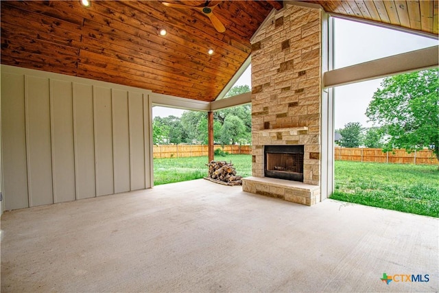 6864 Moffat Loop, Temple, TX 76502 - view of patio / terrace with an outdoor stone fireplace, ceiling fan, and a fenced backyard