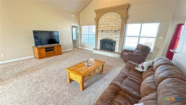 living room featuring high vaulted ceiling, carpet, and a fireplace