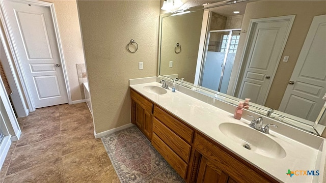 bathroom featuring vanity and separate shower and tub