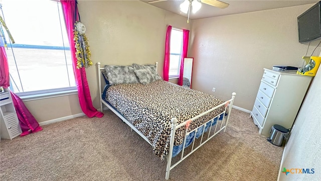 carpeted bedroom with ceiling fan