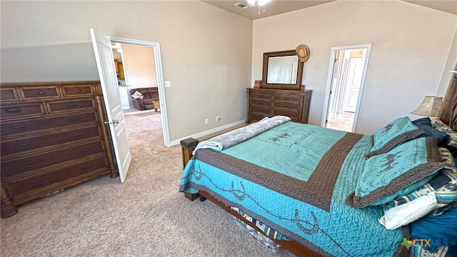 carpeted bedroom featuring vaulted ceiling