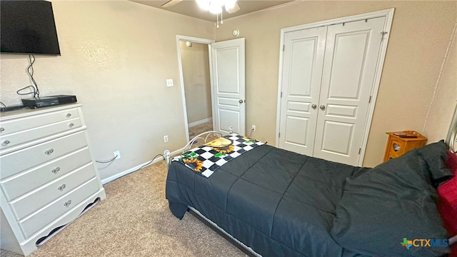 carpeted bedroom featuring a closet