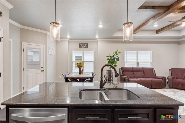 1606 Fiddle Wood Way, Temple, TX 76502 - kitchen featuring a sink, healthy amount of natural light, crown molding, a kitchen island with sink, and dark stone countertops