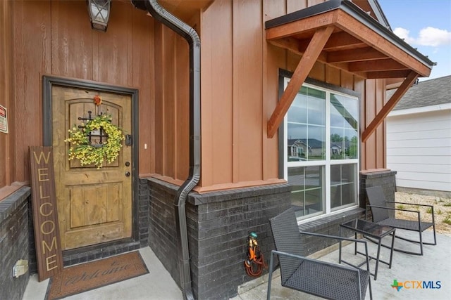 1606 Fiddle Wood Way, Temple, TX 76502 - property entrance featuring board and batten siding and a porch