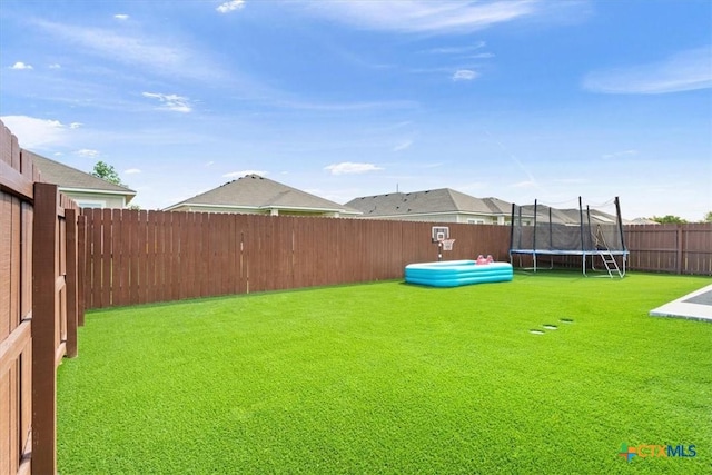 1606 Fiddle Wood Way, Temple, TX 76502 - view of yard with a trampoline