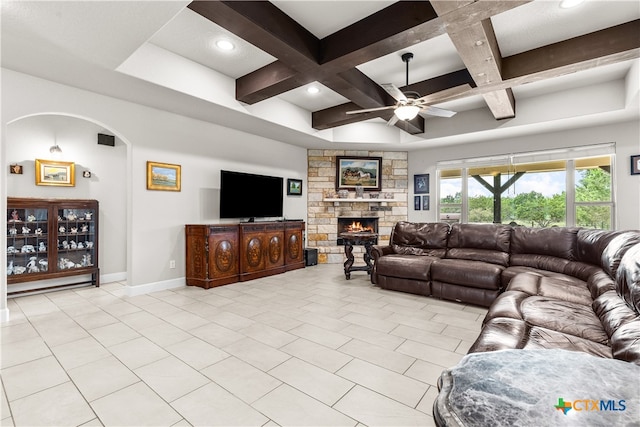 living room with a fireplace, coffered ceiling, light tile patterned flooring, and beam ceiling