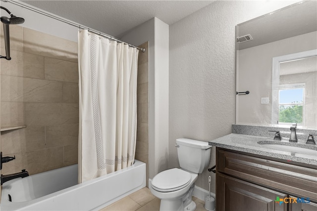 full bathroom with shower / bath combo with shower curtain, toilet, tile patterned flooring, a textured ceiling, and vanity