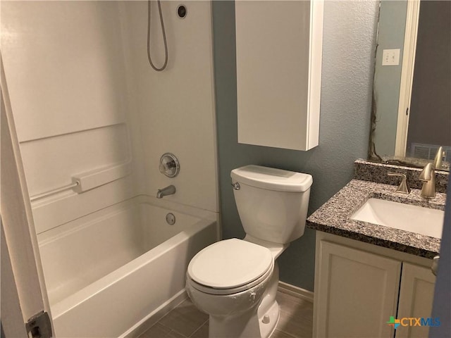 full bathroom with tile patterned floors, vanity, bathing tub / shower combination, and toilet