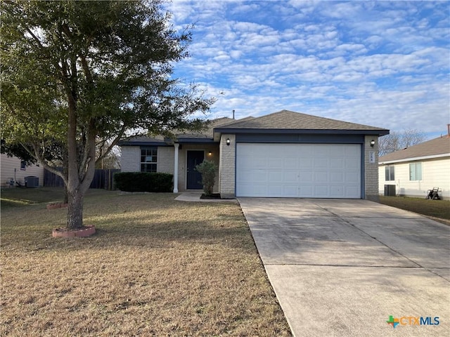 single story home featuring central AC, a garage, and a front lawn