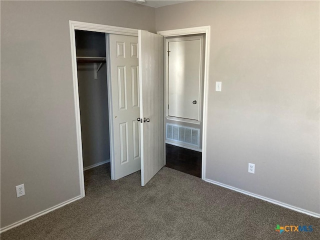 unfurnished bedroom with carpet floors and a closet