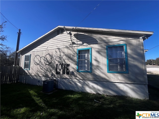 view of side of property with cooling unit