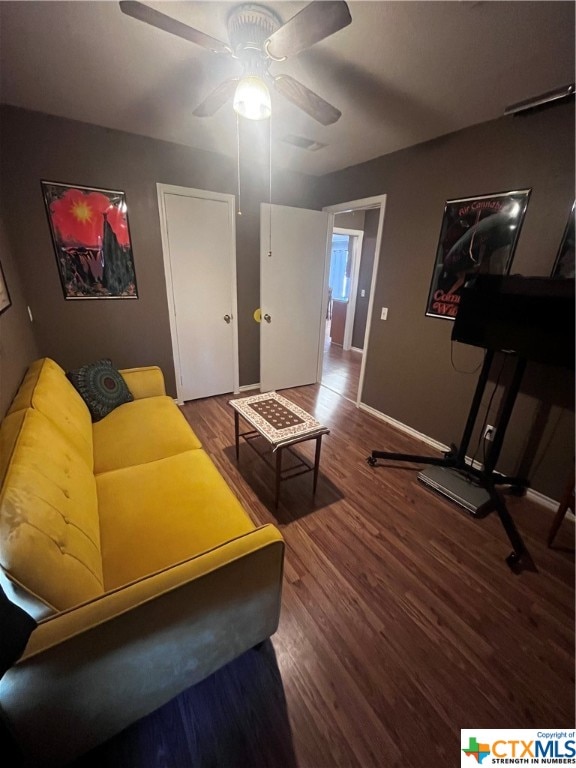 living room with ceiling fan and wood-type flooring