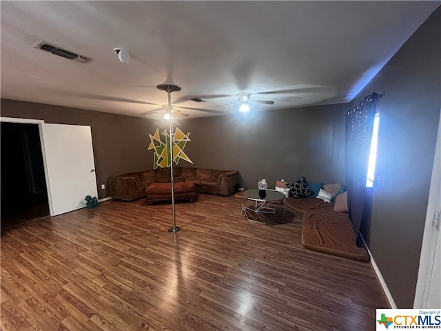 sitting room featuring ceiling fan and dark hardwood / wood-style flooring