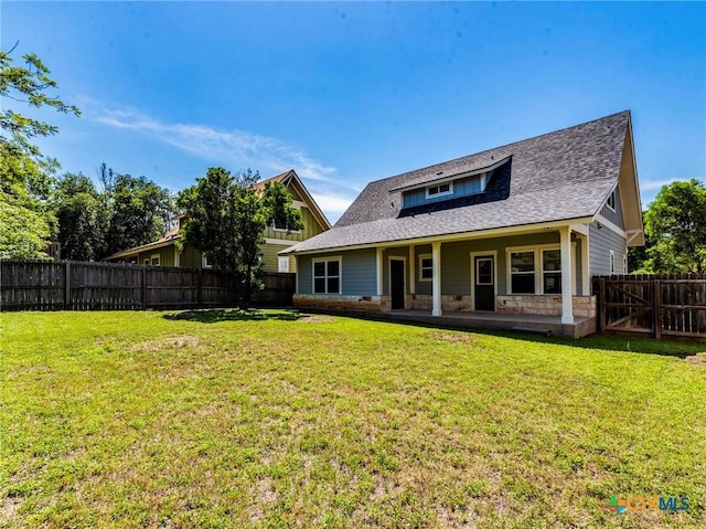 207 Yale St, San Marcos, TX 78666 - view of front facade with stone siding, roof with shingles, and a patio area