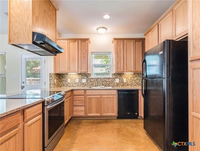 207 Yale St, San Marcos, TX 78666 - kitchen with black appliances, light brown cabinets, a sink, decorative backsplash, and recessed lighting