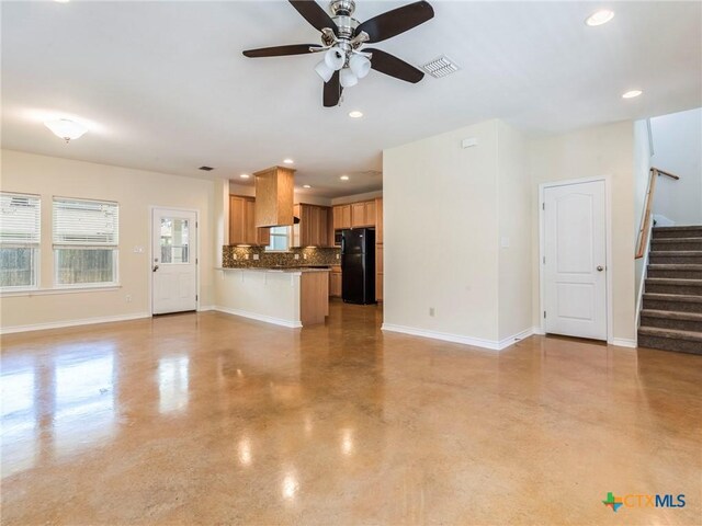 207 Yale St, San Marcos, TX 78666 - unfurnished living room featuring stairs, a ceiling fan, baseboards, recessed lighting, and finished concrete flooring