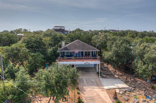 exterior space with a wooded view