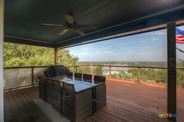 deck featuring a grill and ceiling fan