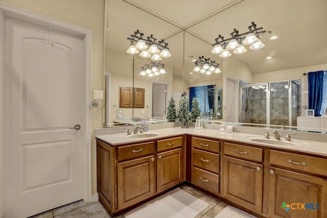 bathroom featuring a sink, a shower stall, and double vanity