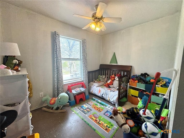 bedroom with ceiling fan, concrete floors, and a textured ceiling