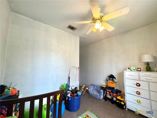 bedroom featuring ceiling fan and concrete floors