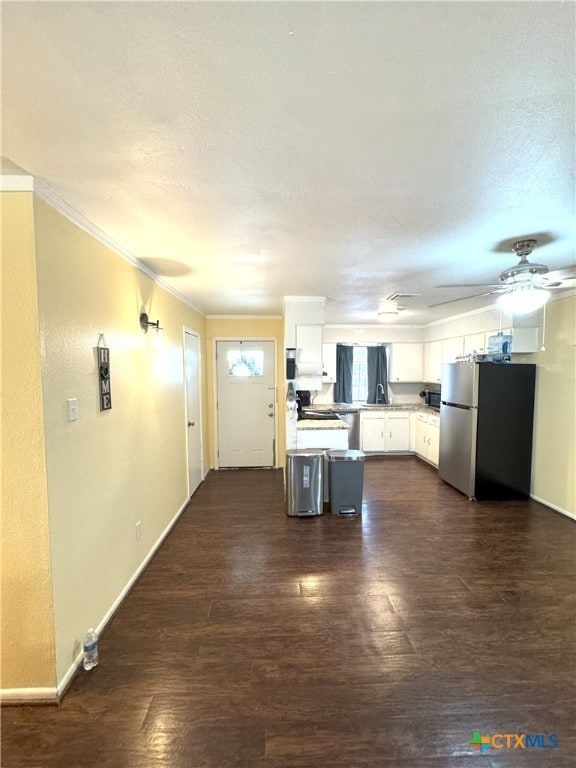 13722 Earlywood St, San Antonio, TX 78233 - kitchen featuring freestanding refrigerator, light countertops, white cabinetry, dark wood finished floors, and ceiling fan