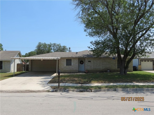 13722 Earlywood St, San Antonio, TX 78233 - ranch-style home featuring driveway, a garage, and an attached carport