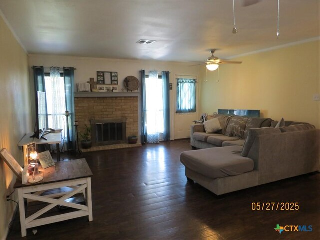 13722 Earlywood St, San Antonio, TX 78233 - living room with healthy amount of natural light, ceiling fan, crown molding, a brick fireplace, and wood finished floors