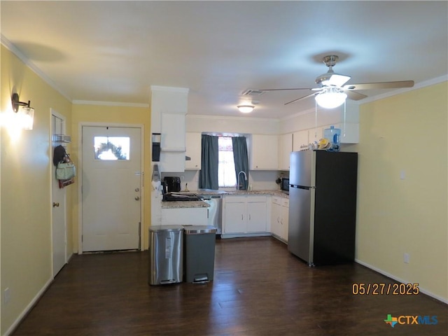 13722 Earlywood St, San Antonio, TX 78233 - kitchen with freestanding refrigerator, a sink, light countertops, white cabinets, and ornamental molding