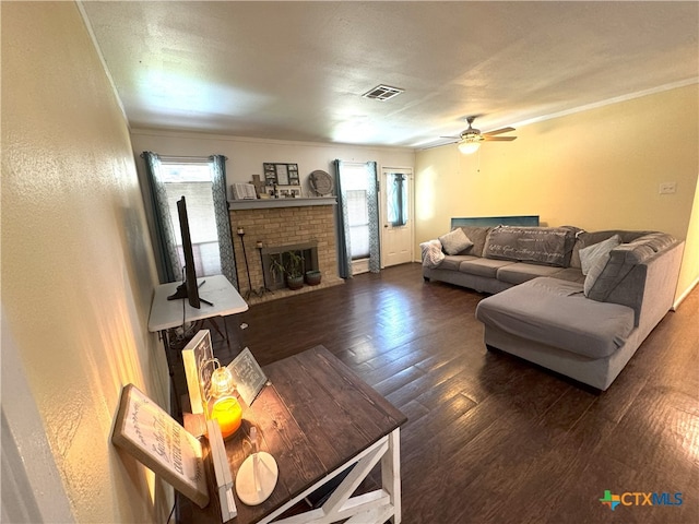 13722 Earlywood St, San Antonio, TX 78233 - living area with wood finished floors, healthy amount of natural light, crown molding, a ceiling fan, and a fireplace