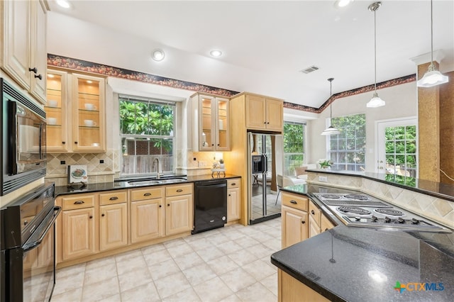 kitchen with black appliances, a sink, plenty of natural light, backsplash, and recessed lighting