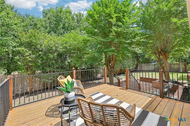 deck with a fenced backyard