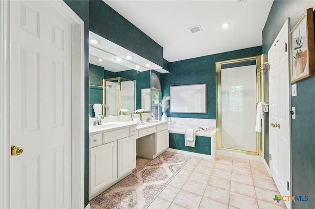 bathroom with a shower stall, a garden tub, vanity, tile patterned flooring, and recessed lighting