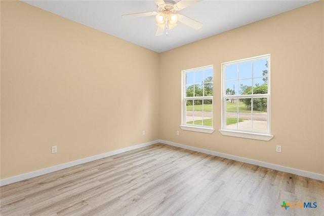 1700 Proctor Ave, Waco, TX 76708 - spare room featuring light wood-style flooring, baseboards, and ceiling fan