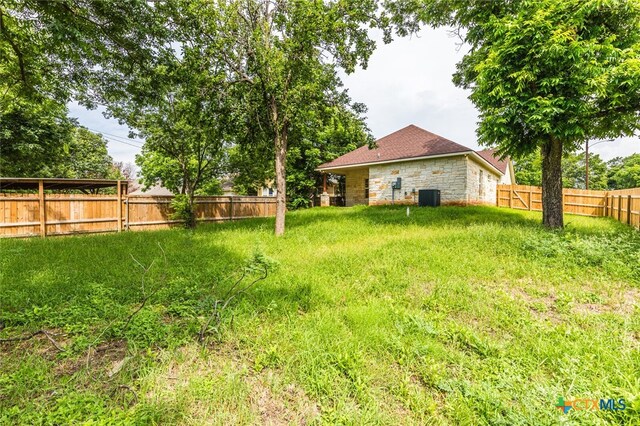 view of yard with central AC