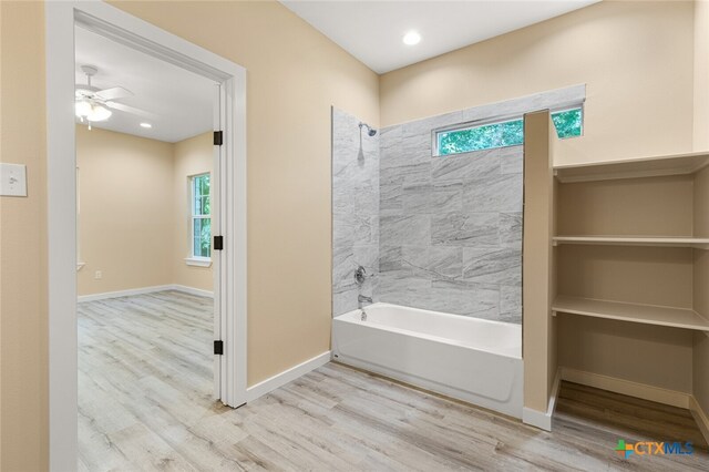 bathroom featuring hardwood / wood-style flooring and plenty of natural light