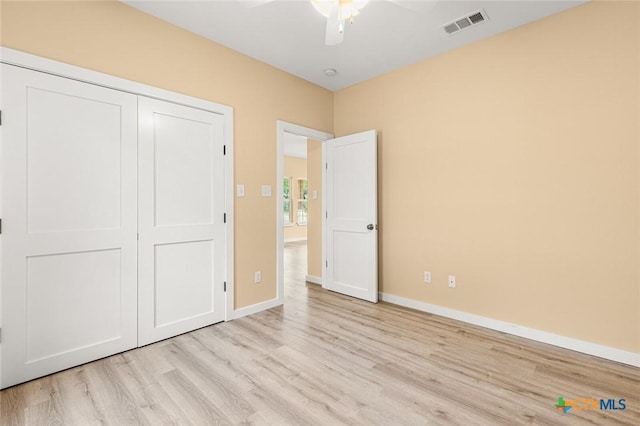 1700 Proctor Ave, Waco, TX 76708 - unfurnished bedroom featuring wood finished floors, baseboards, a closet, and a ceiling fan